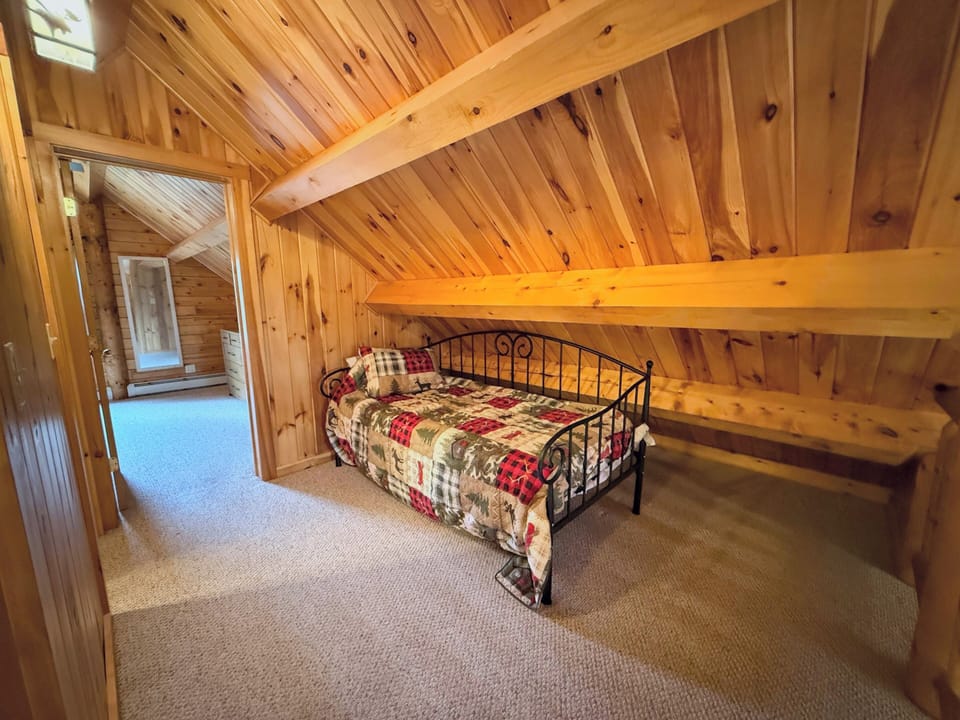 Upper Level Loft area open to main living space with twin bed