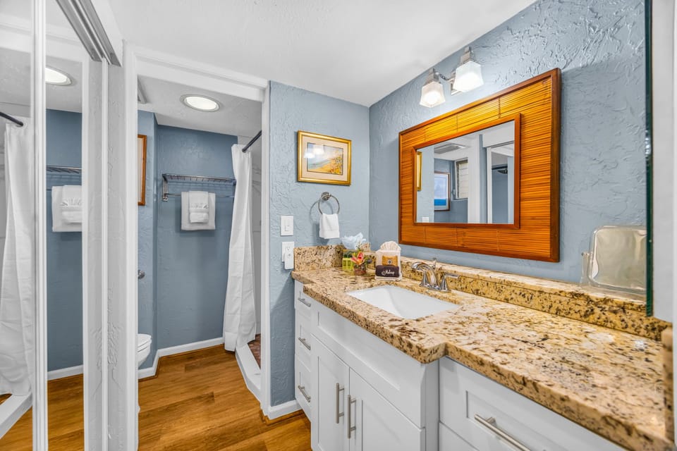 The bath features a spacious countertop, perfect for getting ready PKD-303