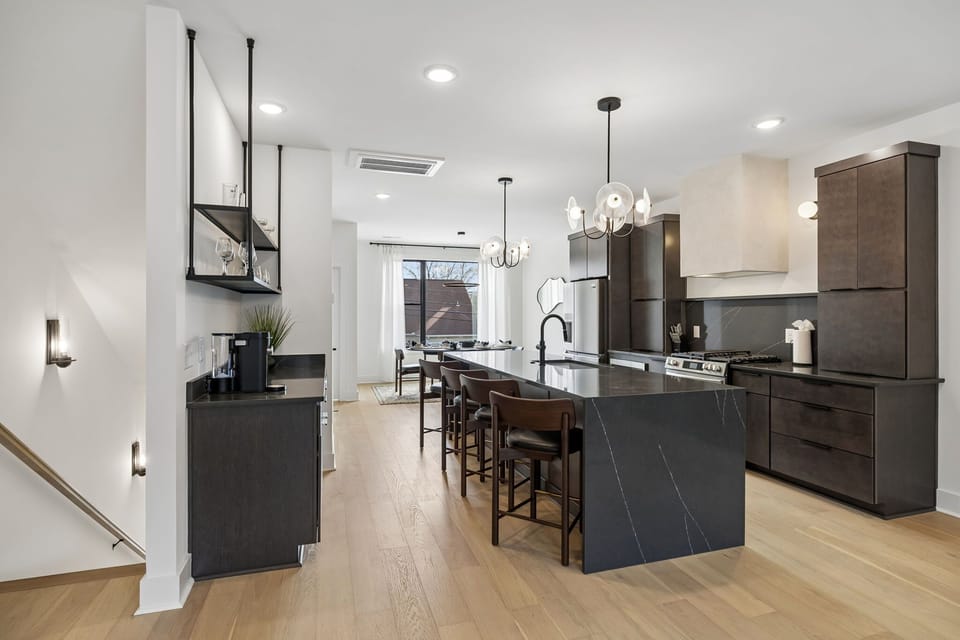 Kitchen: A modern kitchen with sleek cabinetry, stainless steel appliances, and ample counter space.