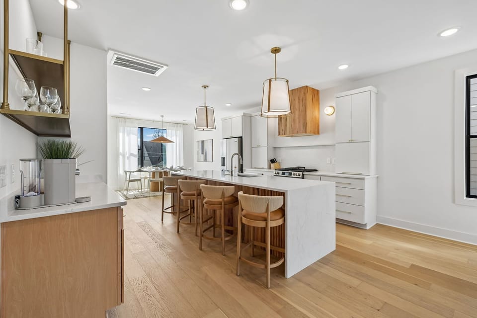 Kitchen: A bright kitchen with a simple yet elegant design.