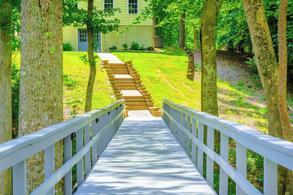 Terraced stone steps connecting the upper yard to the dock. The lake is always just a short walk away.
