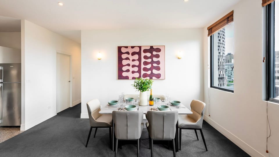 Bright 6 seater dining area positioned beside large windows