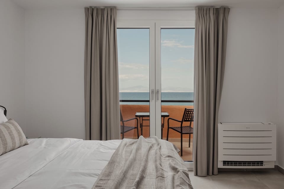 Deluxe Room, Balcony, Sea View | In-room safe, iron/ironing board, free WiFi