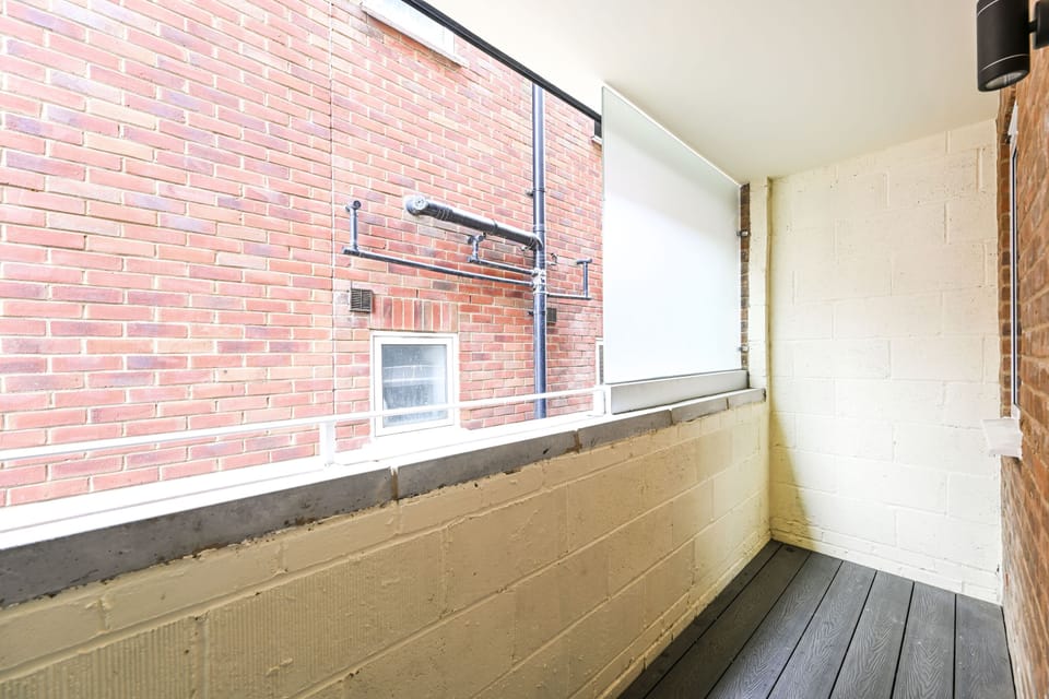 Private patio off the kitchen, enclosed and laid with composite decking