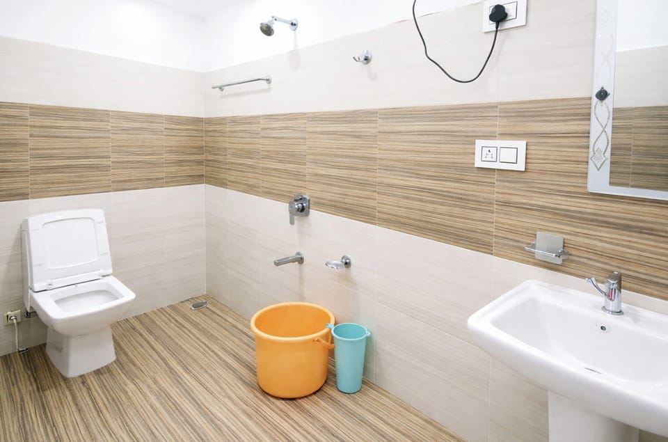 Shower, rainfall showerhead, slippers, towels