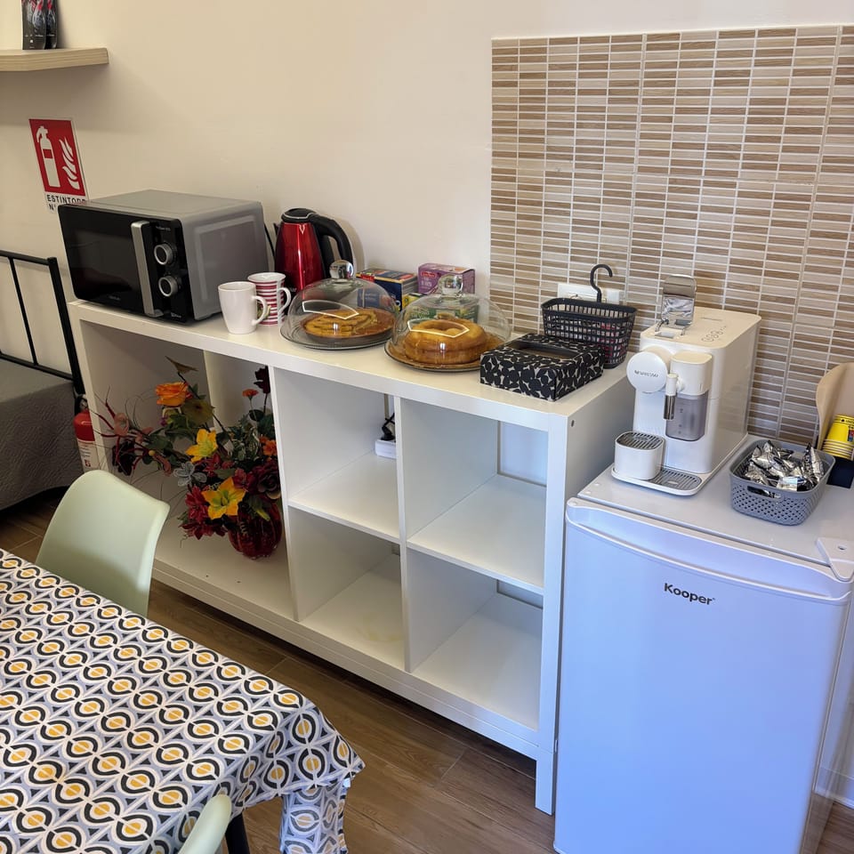Quadruple Room, Patio, Courtyard View | Living area | 32-inch flat-screen TV with cable channels, Netflix, streaming services