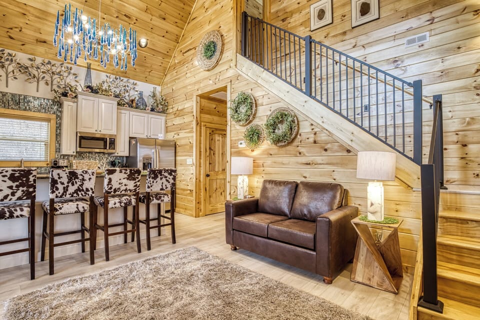 Cabin with a Bowling Alley in Pigeon Forge "Firefly Strike Retreat" - Fully furnished kitchen and living room