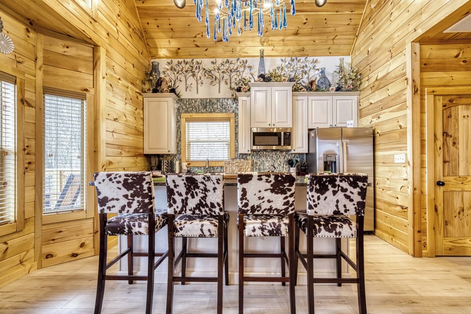 Cabin with a Bowling Alley in Pigeon Forge "Firefly Strike Retreat" - Kitchen island and high top bar stools