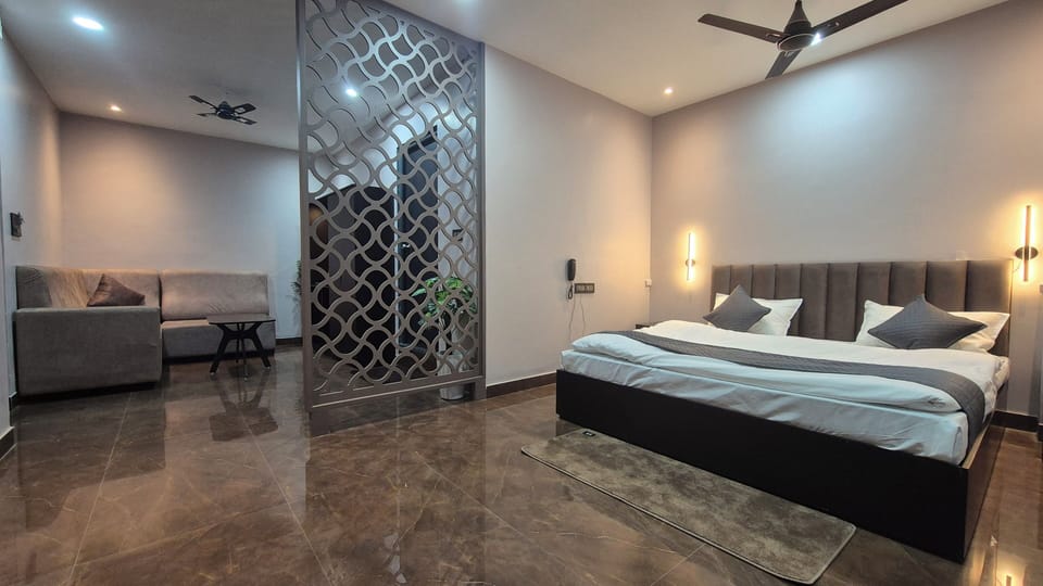Luxury Studio Suite, City View | Desk, laptop workspace, blackout drapes, iron/ironing board