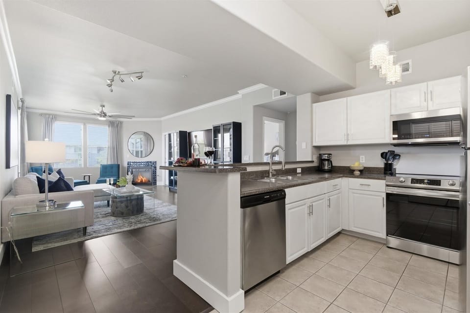 Fully equipped kitchen with stainless steal appliances and ample counter space with bar seating for 3 guests.