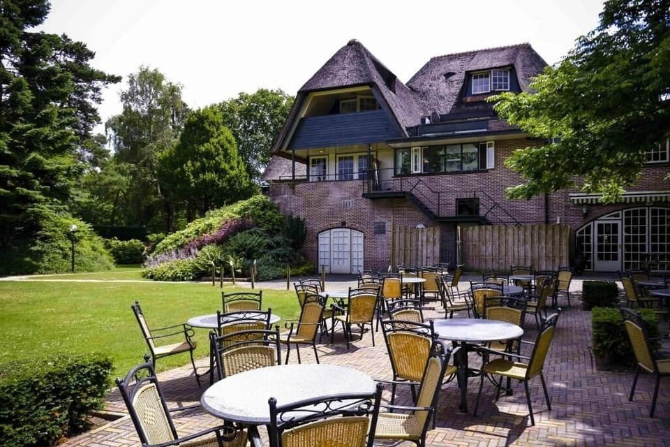 Unwind on the sunny terrace surrounded by lush greenery.