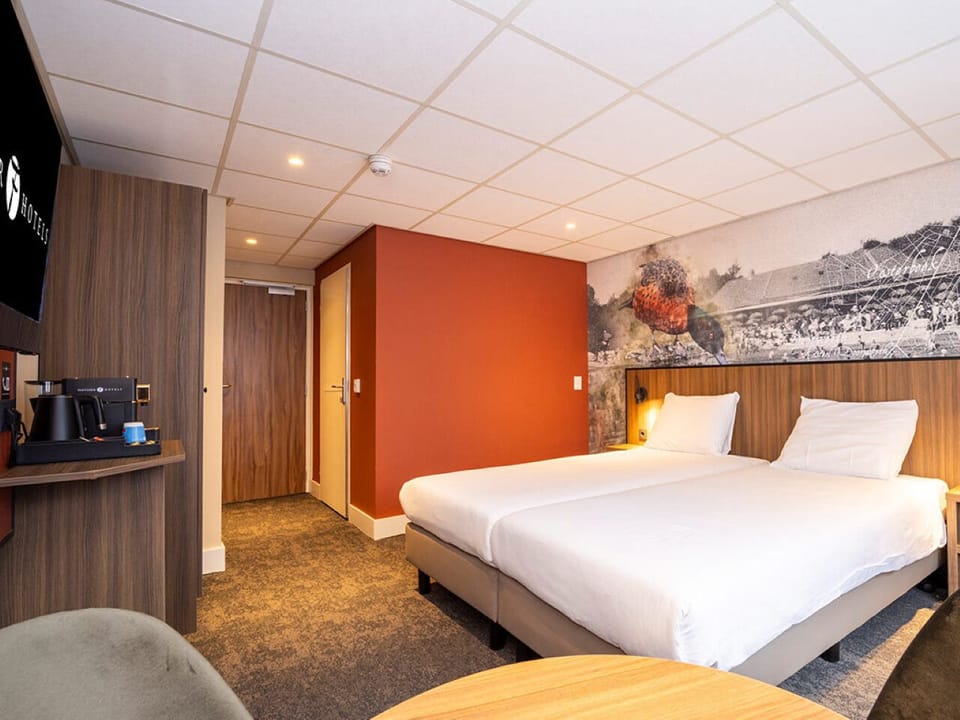 Stretch out comfortably in this spacious room with modern finishes.