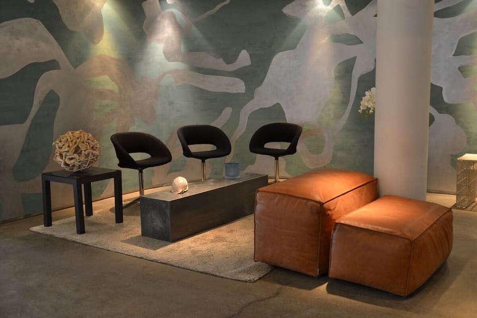 Sink into plush seating and savor the calm, artful vibe.