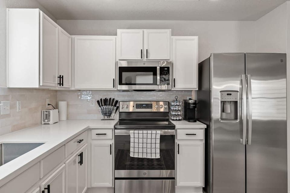 Well-equipped kitchen with sleek finishes
