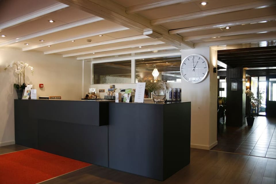 Check in smoothly at the sleek reception desk.