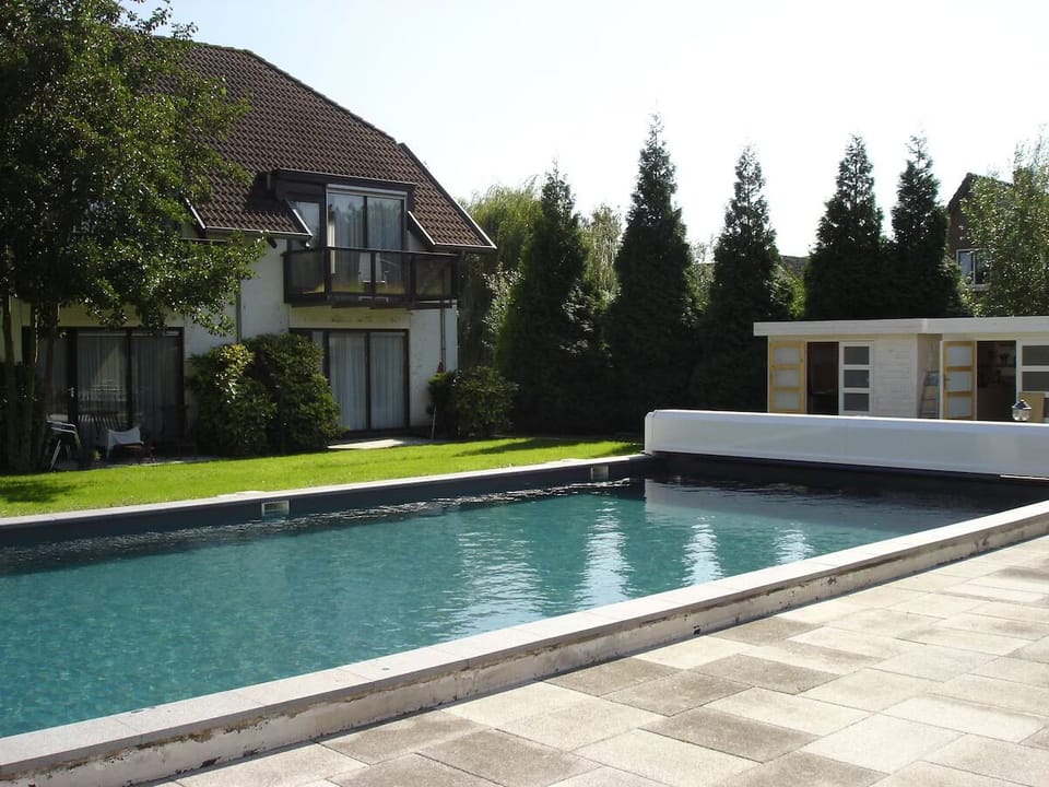 Dive into sunlit serenity beside your private, sparkling pool.