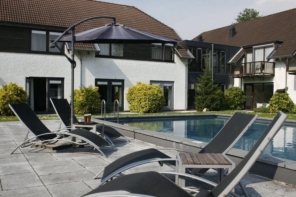 Unwind poolside on sleek loungers in peaceful sunshine.