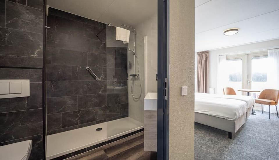 Step from bedroom comfort into a bright, easy-access bathroom.