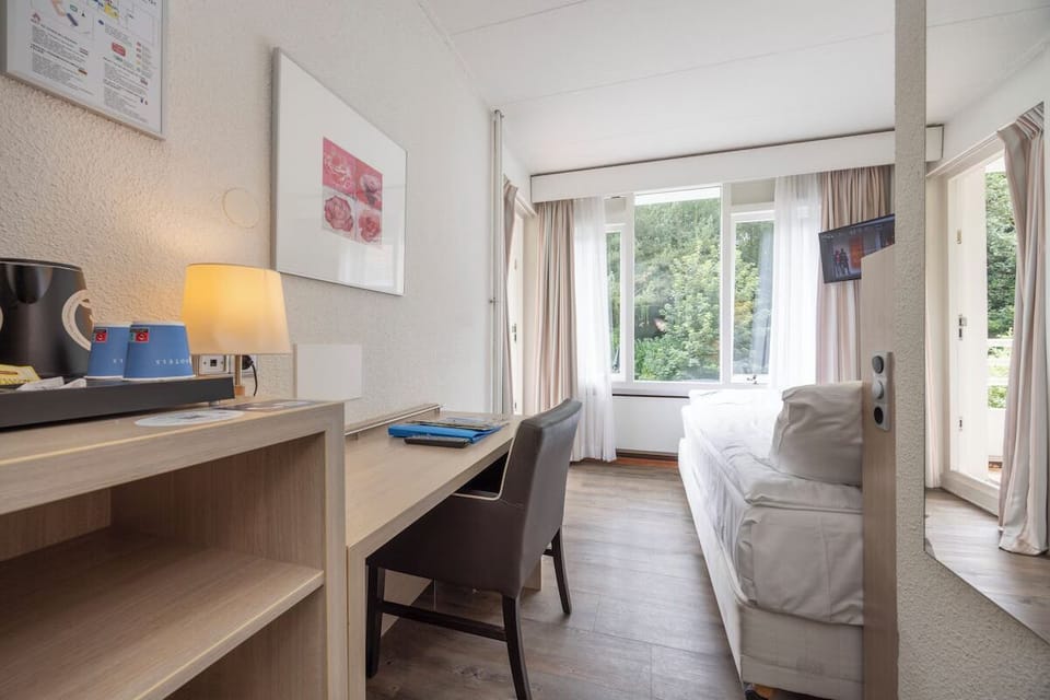 Unwind in a bright room with desk and treetop views