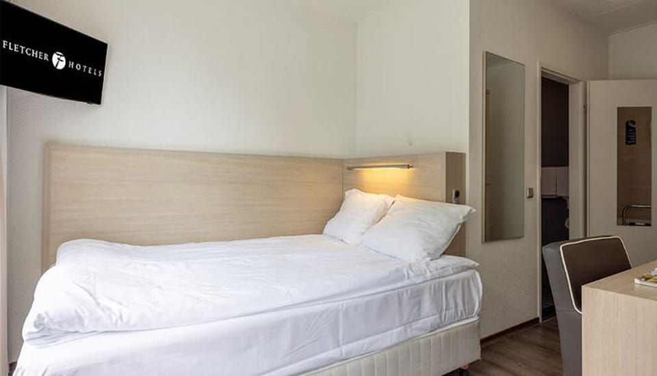 Sink into plush pillows for a quiet, restorative night.