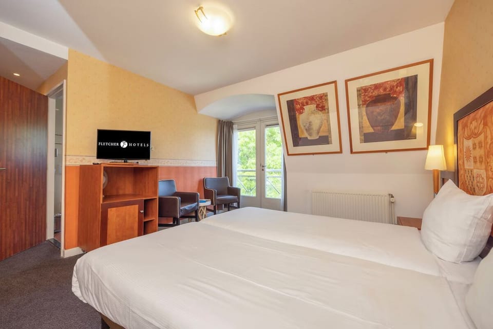 Settle in and enjoy a spacious room with cozy seating.