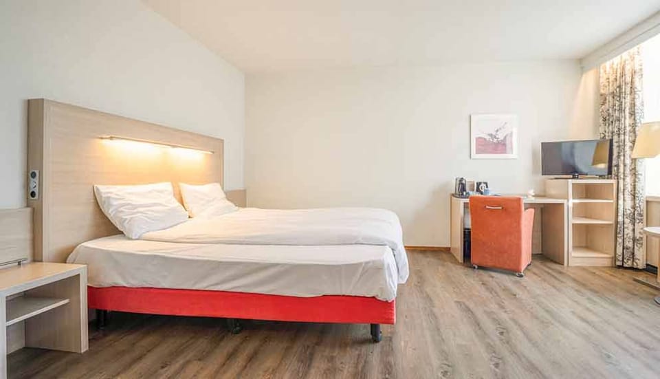 Stretch out comfortably in a bright room with modern essentials.