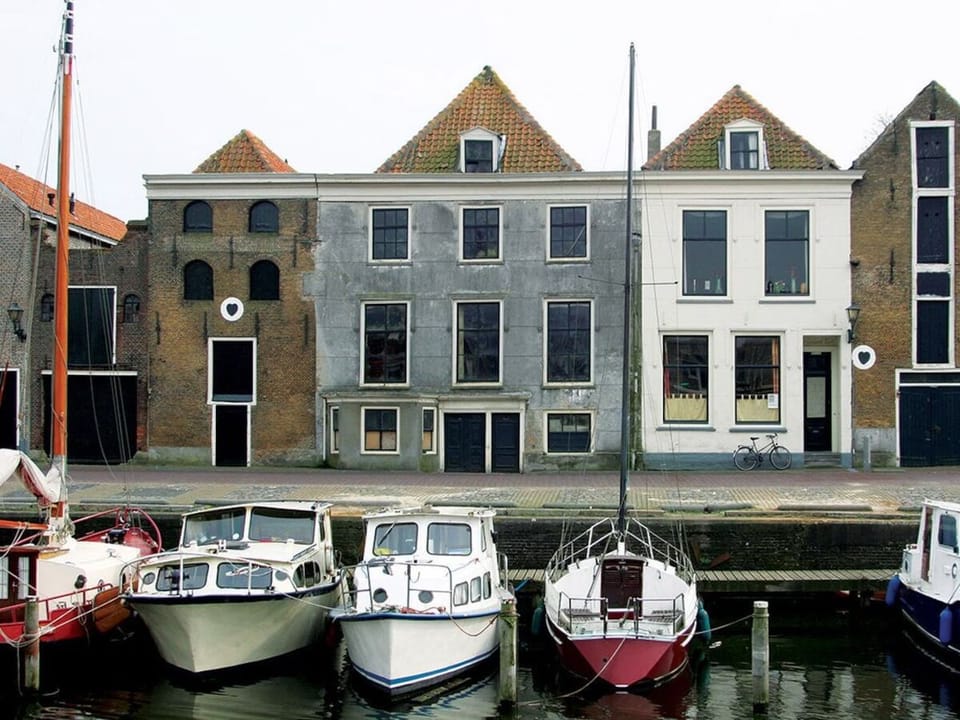 Watch boats drift by from this charming waterfront location.