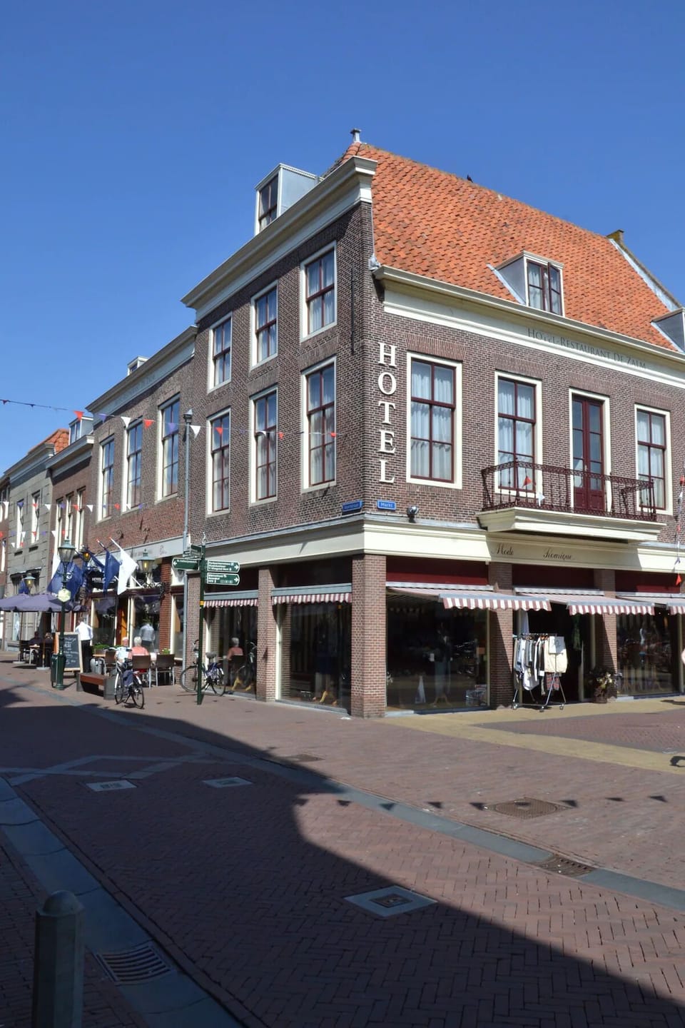 Arrive to a classic hotel façade in the heart of town.