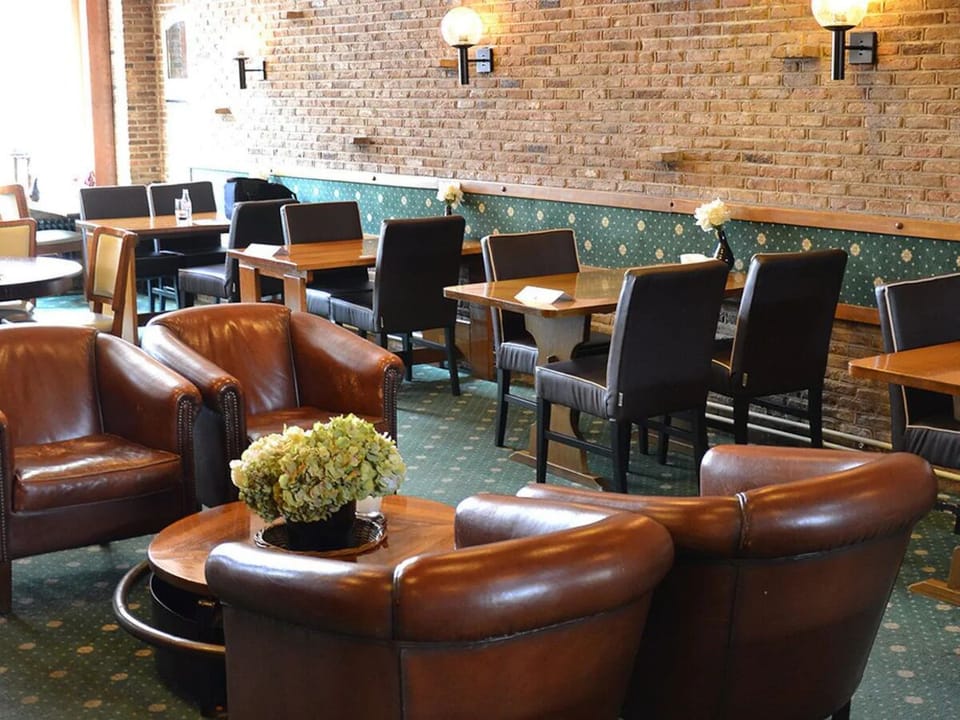 Unwind in leather armchairs with a drink and conversation.
