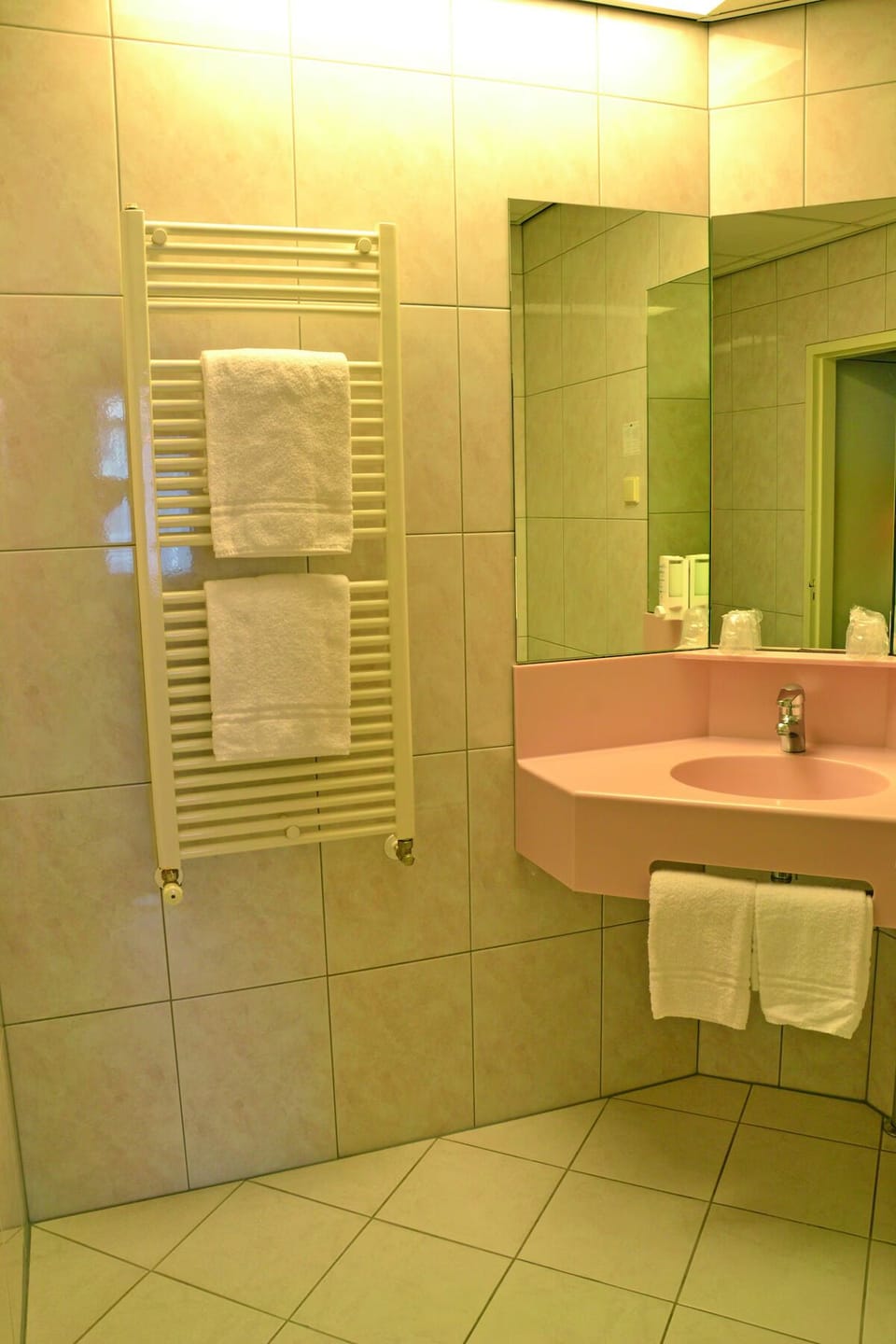 Warm up after showers with fluffy towels on the rail.
