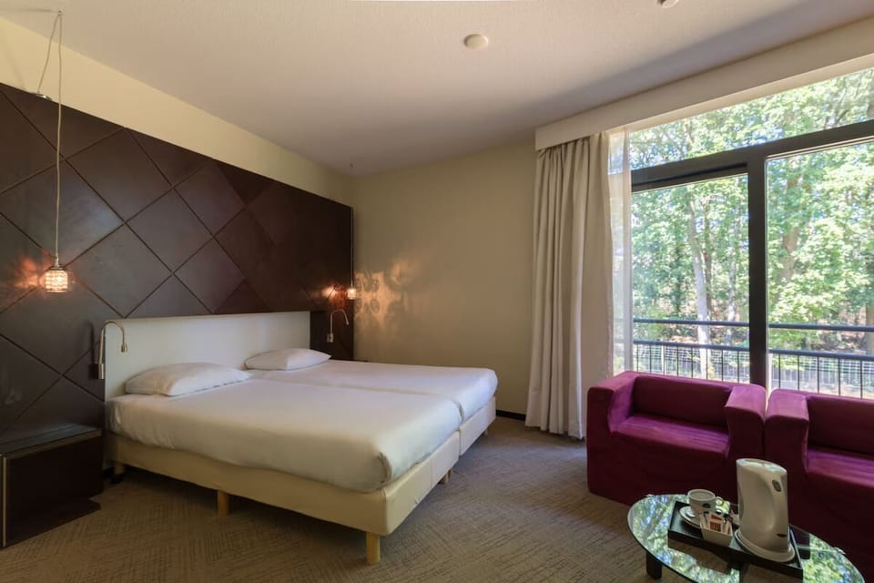 Wake up to treetop views from a serene, spacious bedroom.