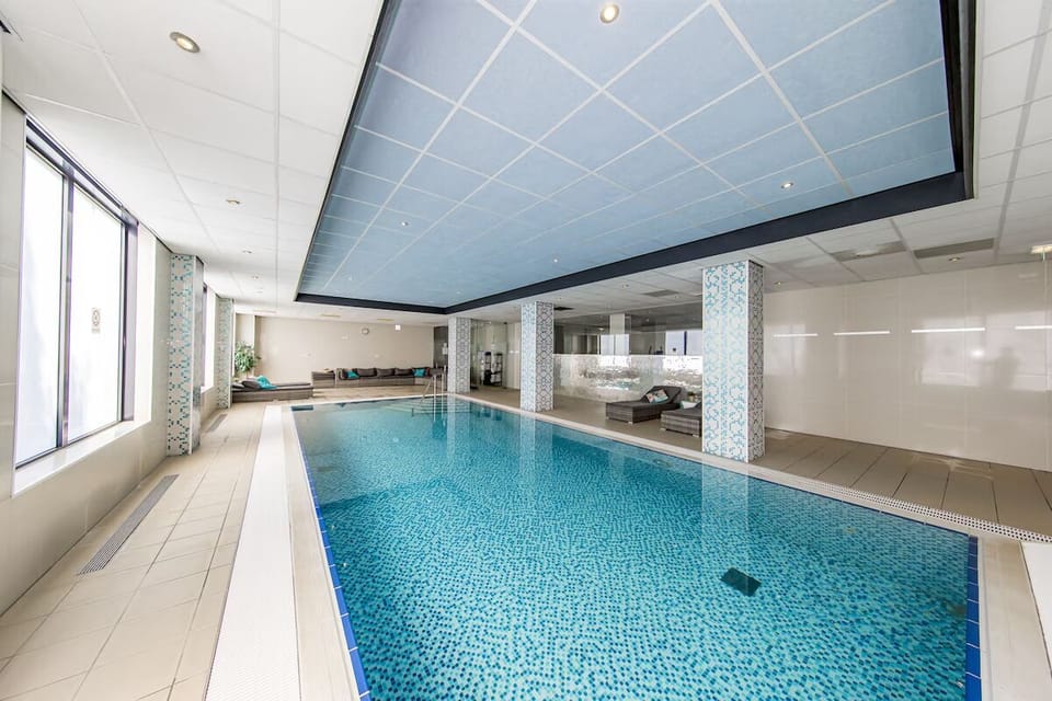 Unwind with a refreshing swim in the serene indoor pool.
