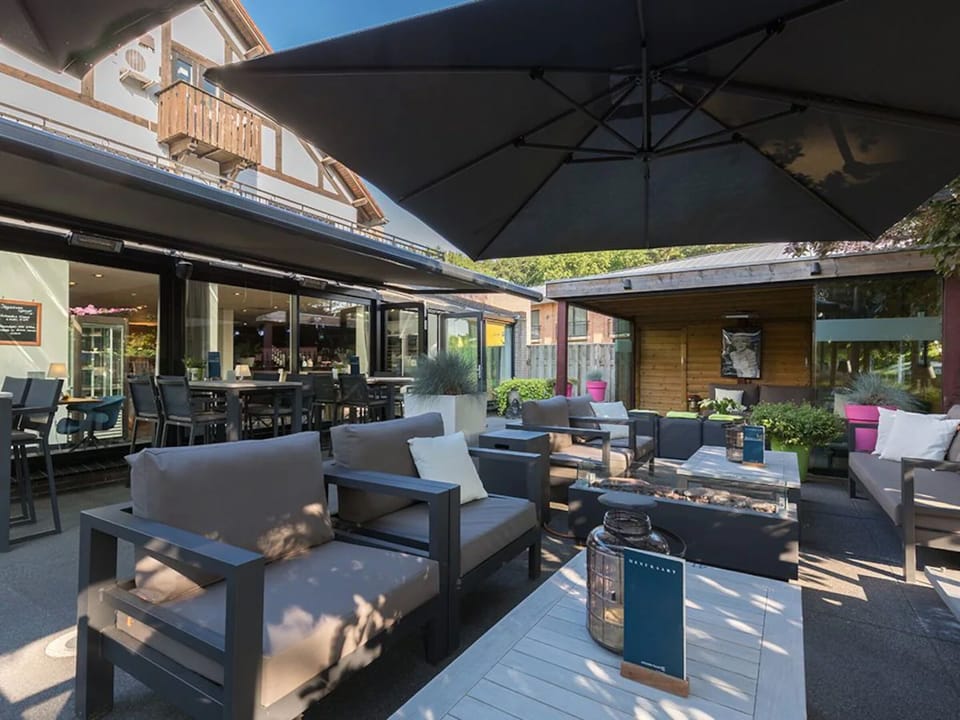 Relax into plush outdoor sofas for a laid-back evening.
