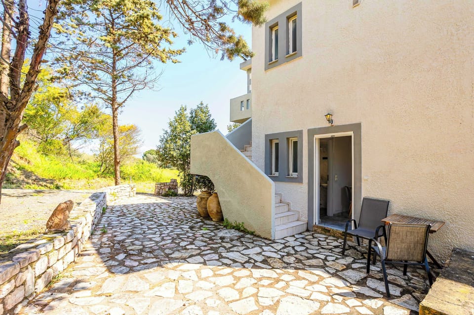 Exterior View of the Property with Garden and Patio Area
