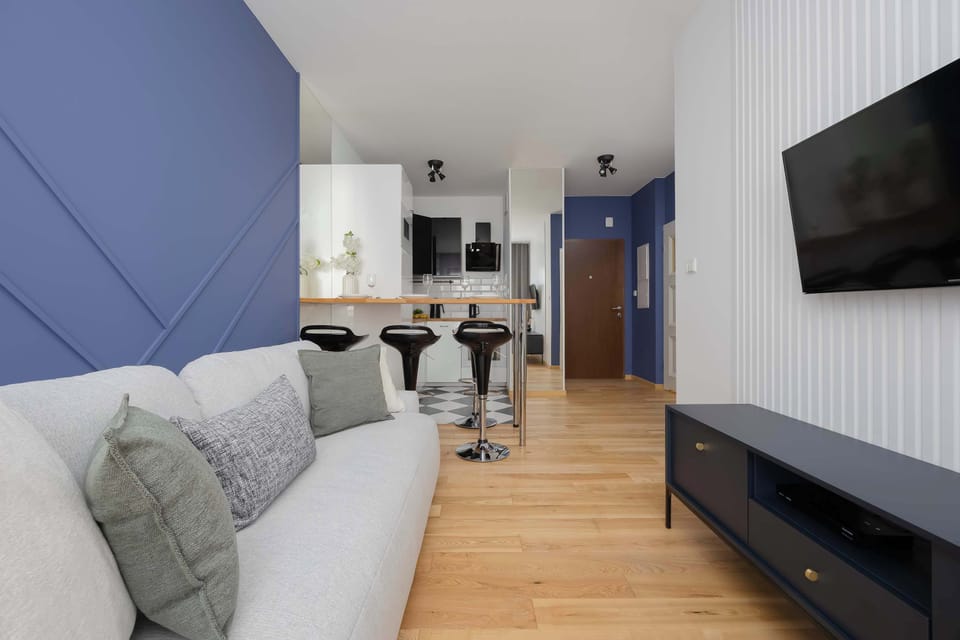 A long view of the living room leading toward the kitchenette area.