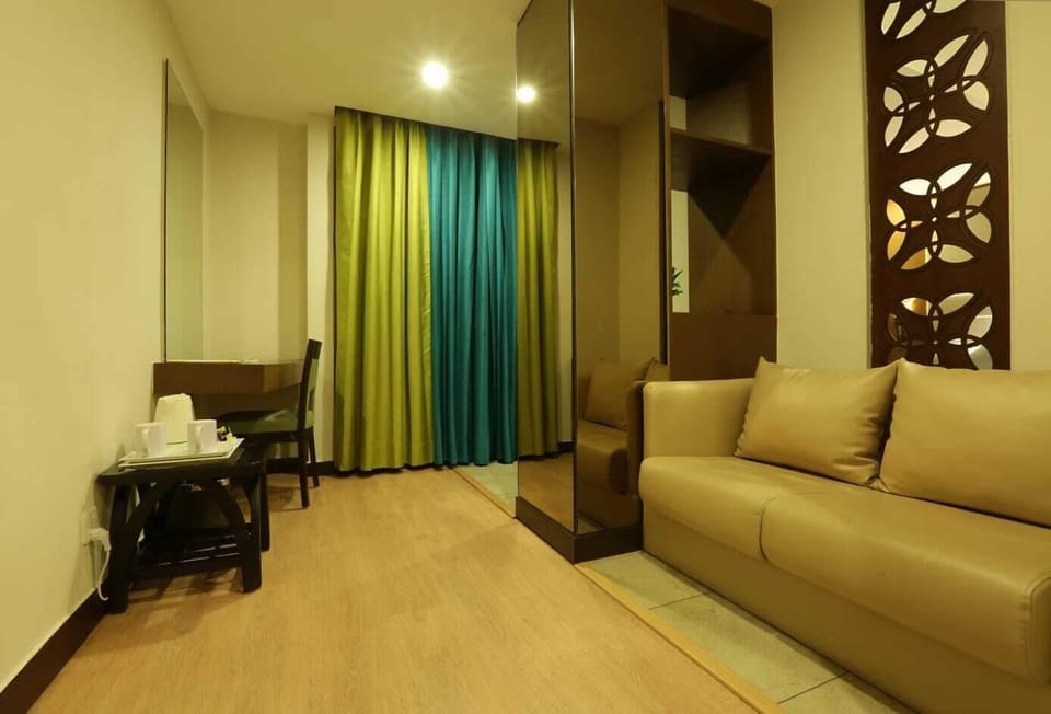 Double Room | Living area | 42-inch LED TV with cable channels, DVD player, pay movies
