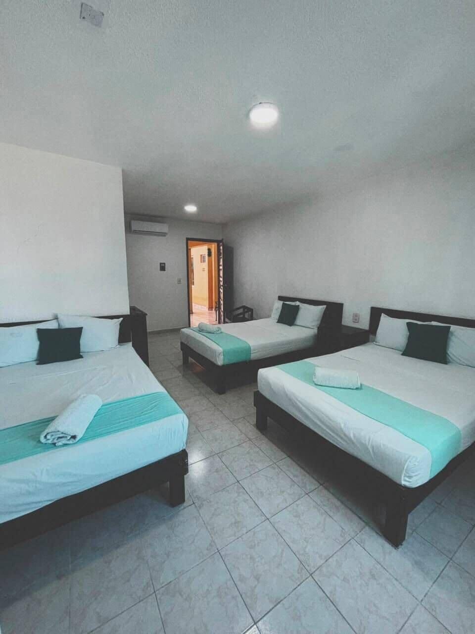 Classic Triple Room, City View | Down comforters, iron/ironing board (on request), WiFi (free)