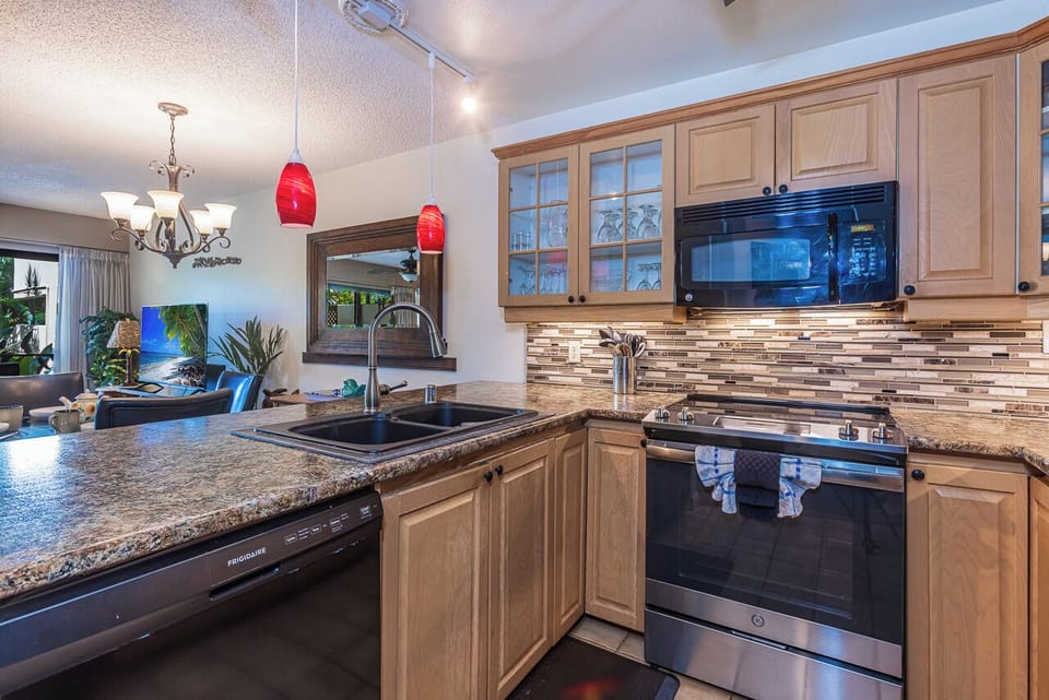Your gourmet kitchen features granite countertops, premium appliances.