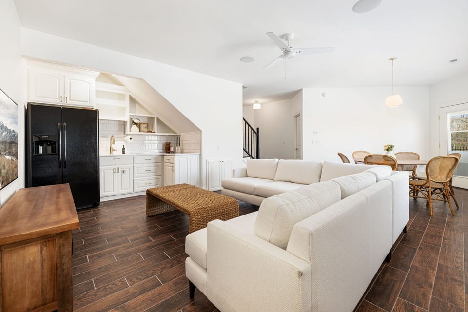 Enjoy another living space, large Smart TV with Sonos sound system, seating, and kitchenette.