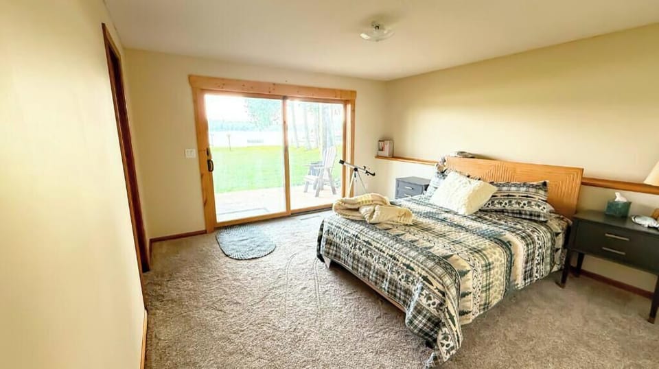 Lower-level bedroom with queen bed