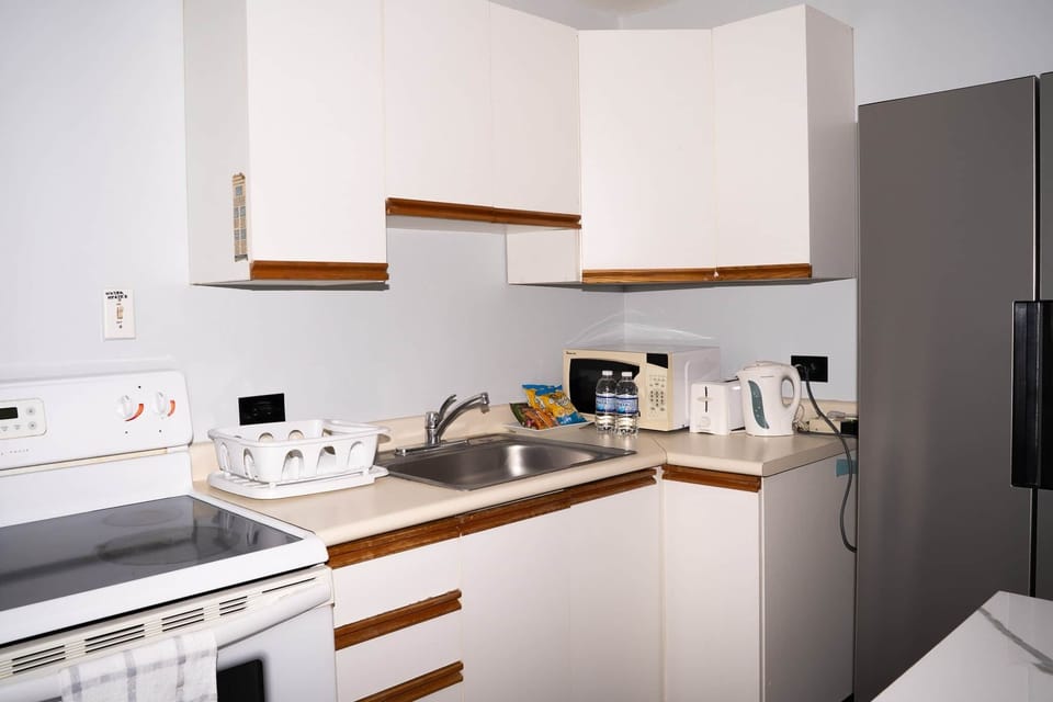 Fully equipped kitchen — fridge, stove, microwave & everything for long stays