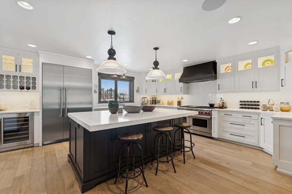 Your gourmet kitchen awaits with gleaming quartz counters, professional appliances, and a spacious island perfect for cooking memorable meals together.