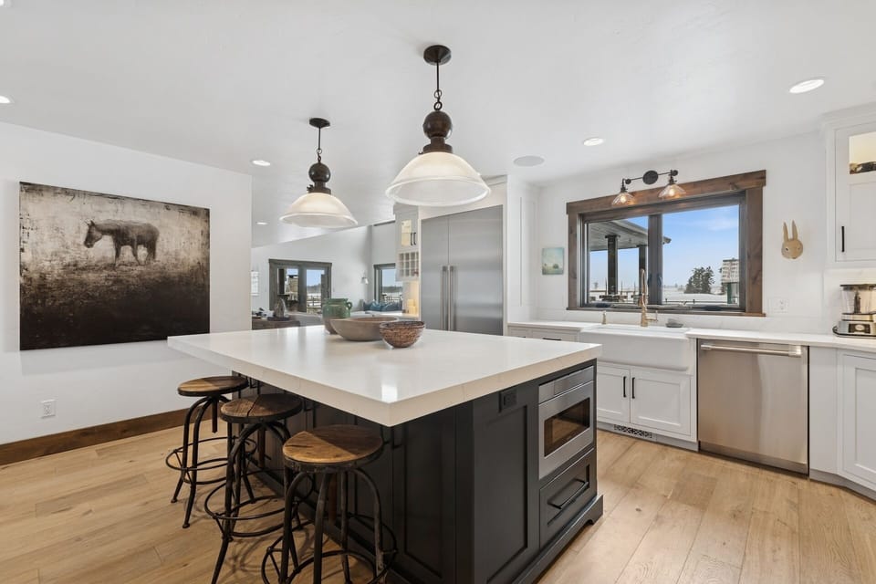 Cook memorable meals in your modern kitchen featuring gleaming granite counters, stainless steel appliances, and a spacious island perfect for morning coffee.