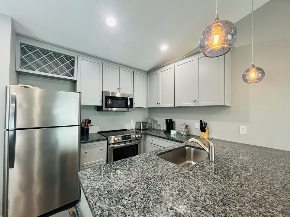 Kitchen island with breakfast bar.