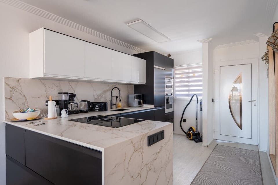 The modern kitchen is fully equipped with high-end appliances, including a coffee maker, toaster, and air fryer, to make your holiday cooking effortless. You`ll find everything you need to prepare a full dinner or just a quick snack for the beach.