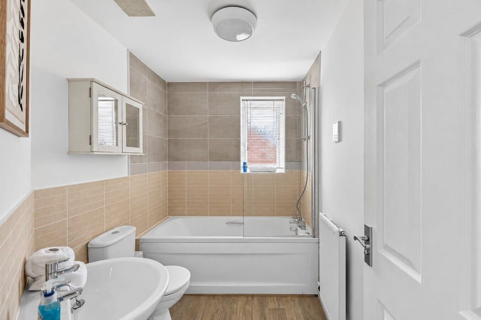 Bathroom with a shower over bath and complimentary toiletries provided.