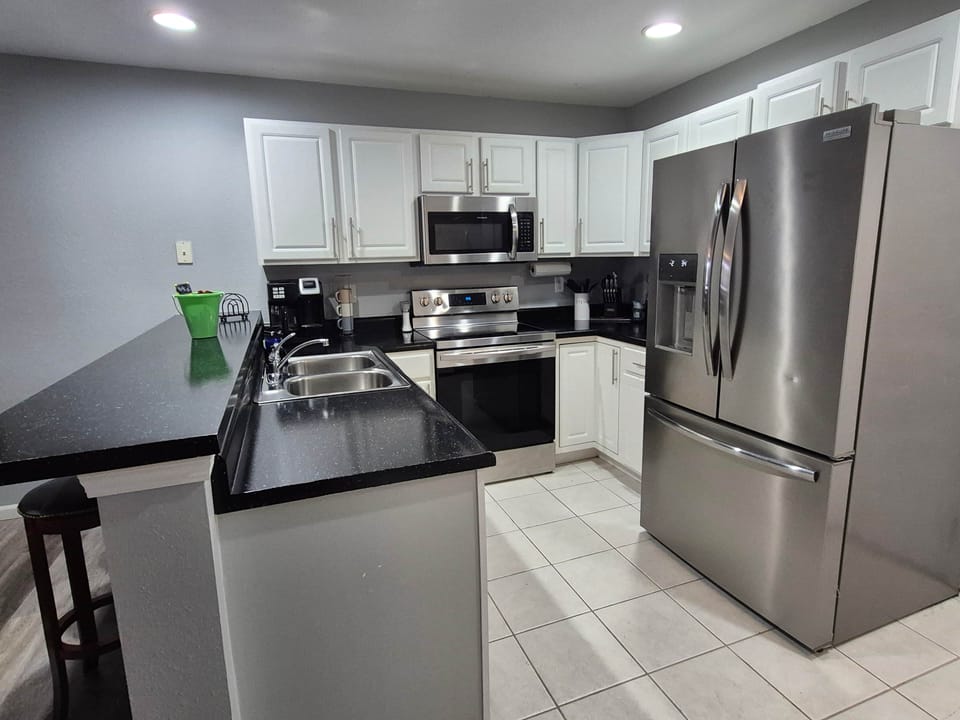 Fully stocked kitchen with modern appliances—everything you need for home-cooked meals