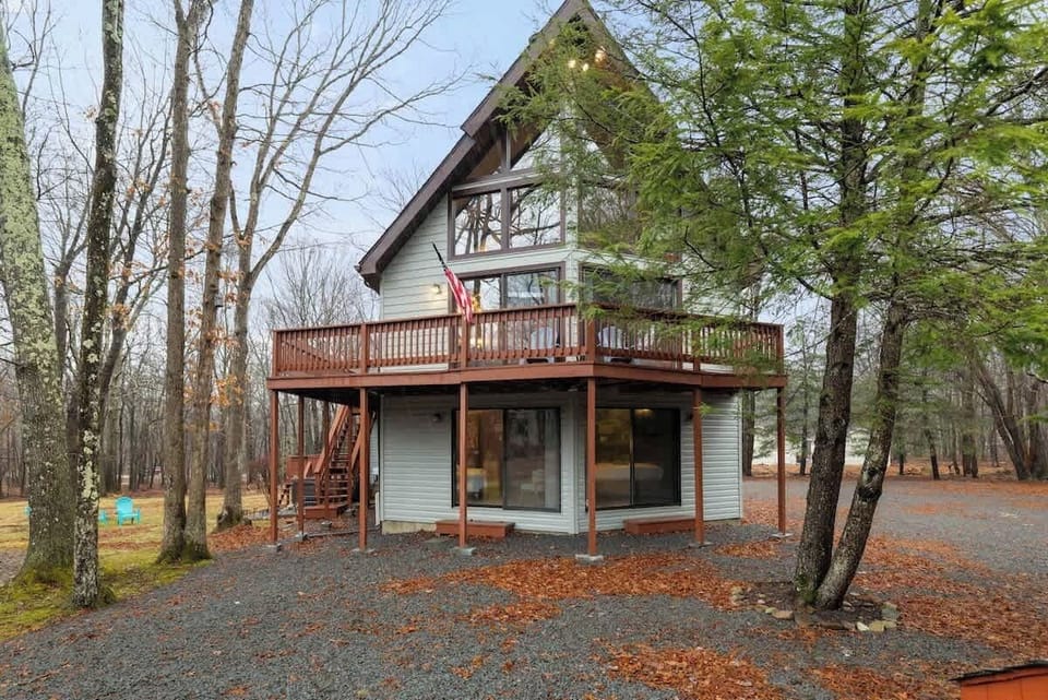 Embrace nature from the expansive deck amid towering trees and serene views!