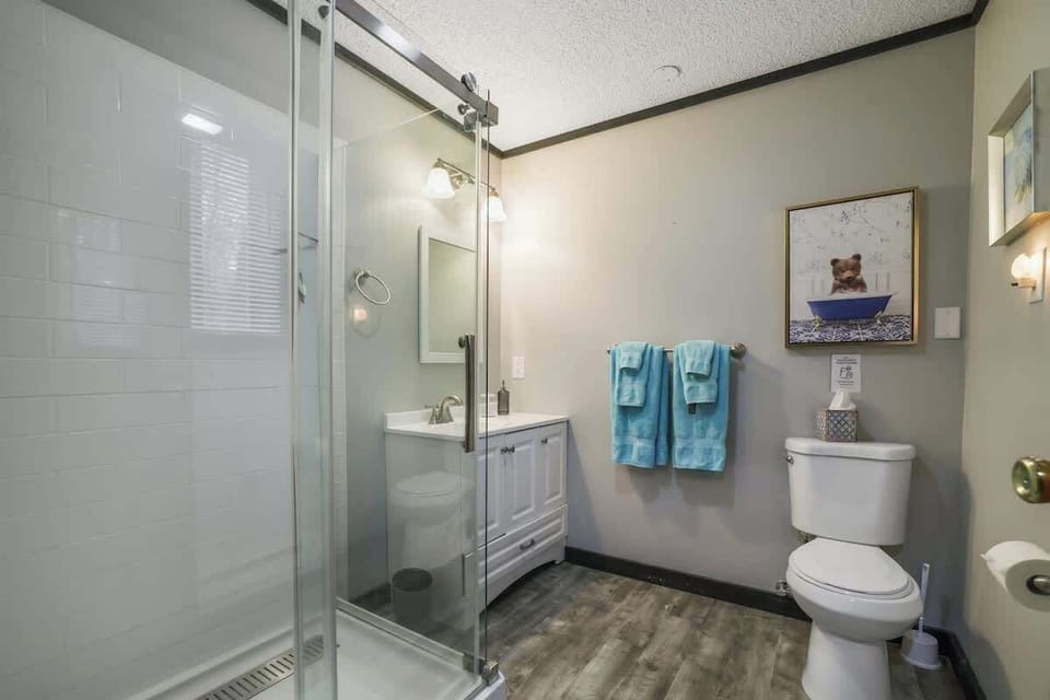 This spacious bathroom provides a calm and convenient space to start and end your day.