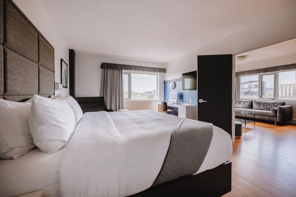 Deluxe Suite, 1 King Bed | In-room safe, desk, laptop workspace, blackout drapes